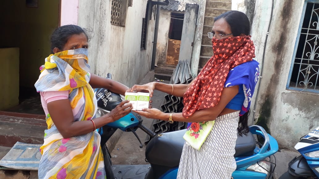 A woman receives her ARV medications provided to her at the doorstep by one of our frontline workers in Pali, Rajasthan.